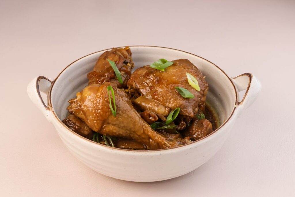 Filipino chicken adobo simmered in vinegar and soy sauce