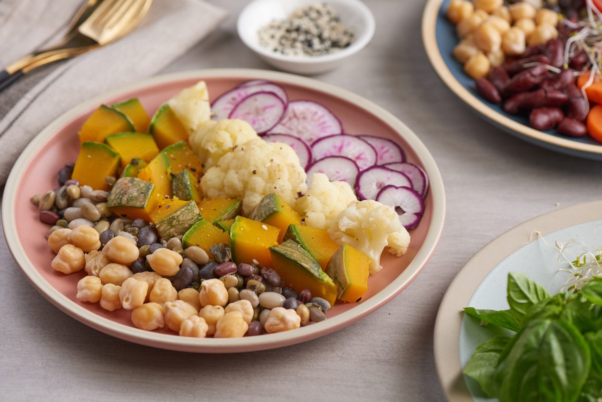 Plate of chickpeas, roasted squash, cauliflower and radishes