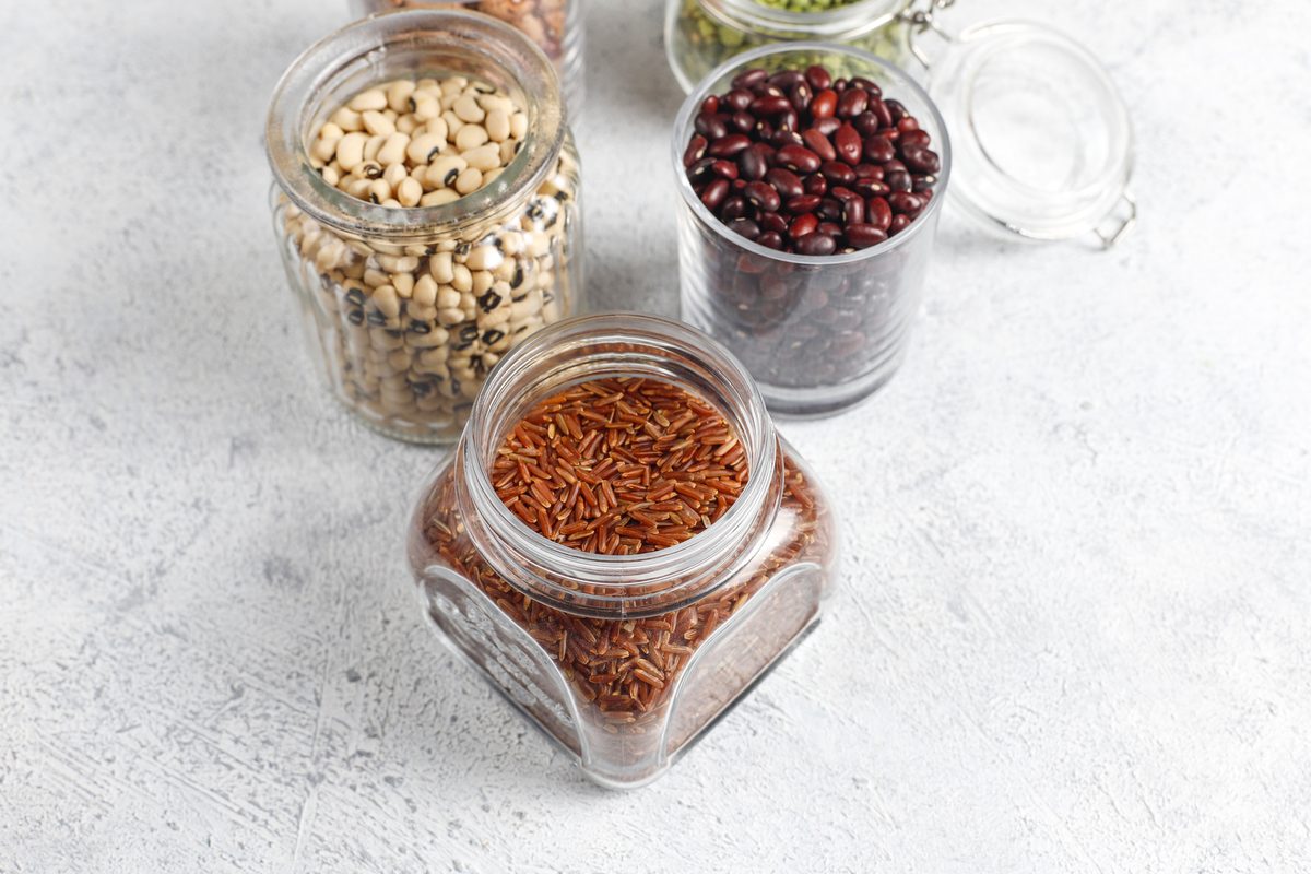 Jars of red rice, kidney beans and dried pulses