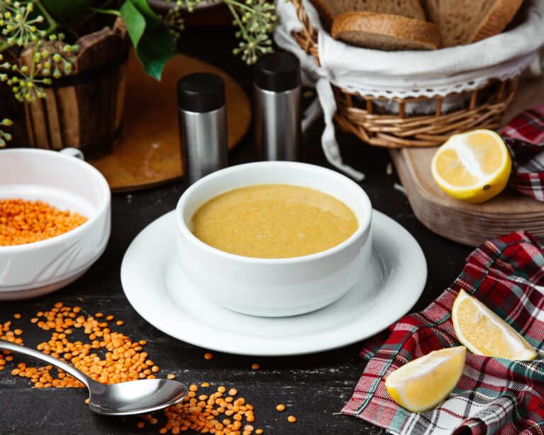 Bowl of lentil soup served with lemon
