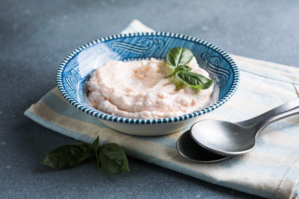 Bowl of pink taramasalata served with lemon
