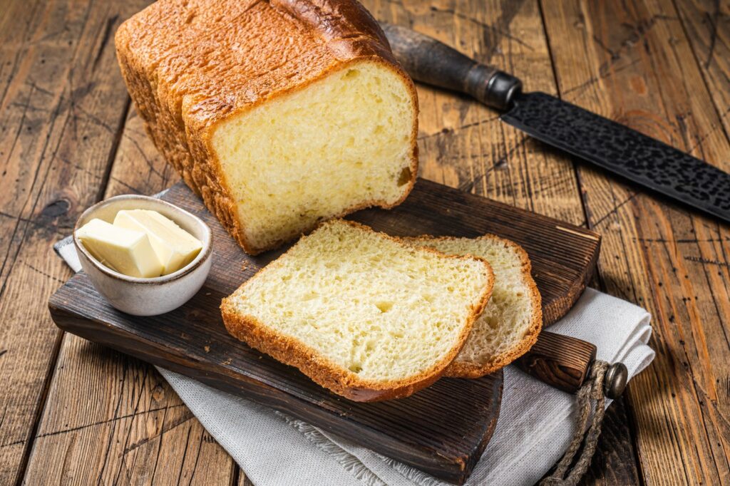 Sliced homemade brioche with butter