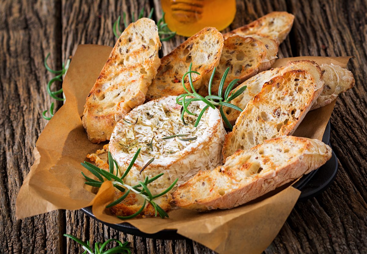 Baked camembert with rosemary, served with slices of toasted bread