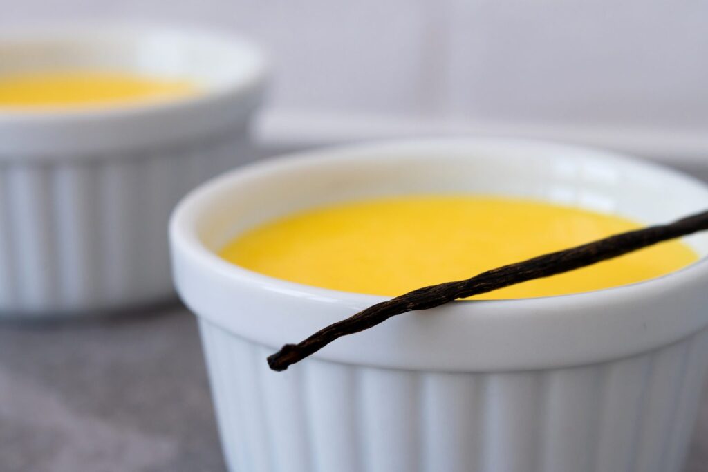 Homemade vanilla custard in a white bowl