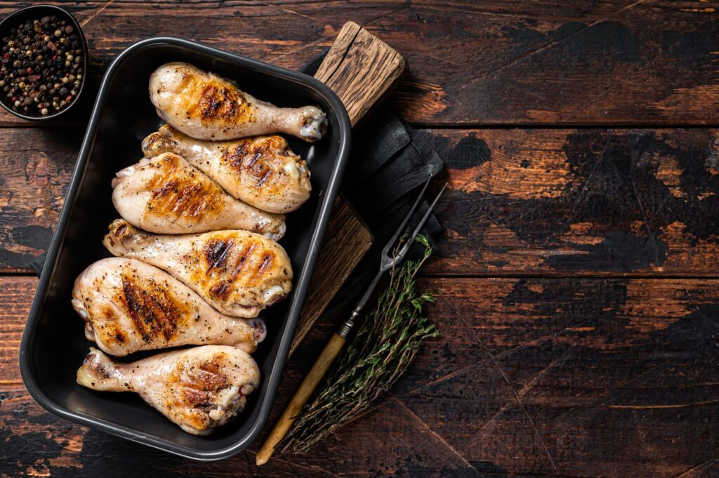 Roast chicken thighs with herbs in a baking dish