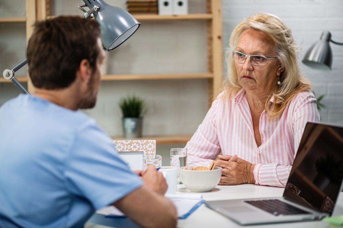 Mature woman listening to her doctor during a consultation