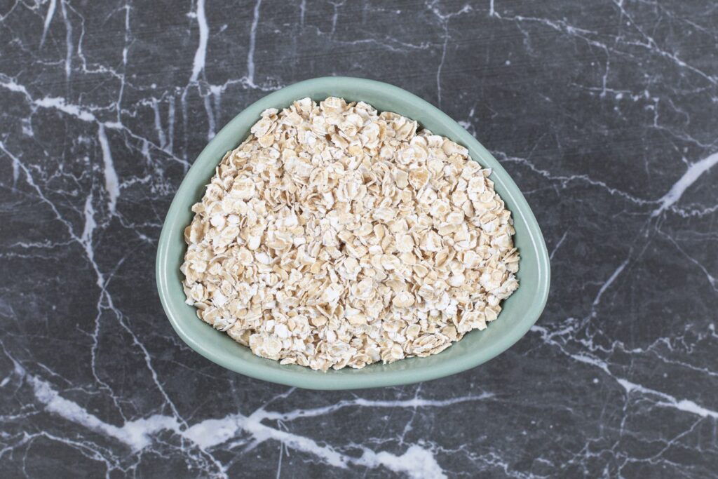 Rolled oats in a wooden bowl