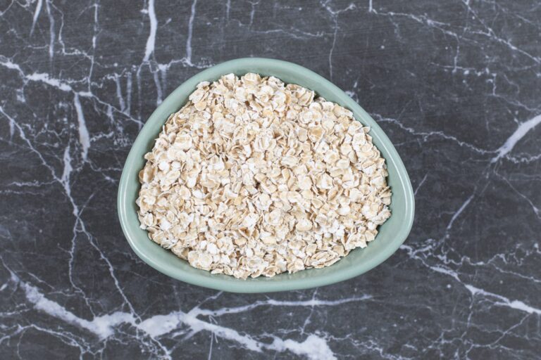 Rolled oats in a wooden bowl