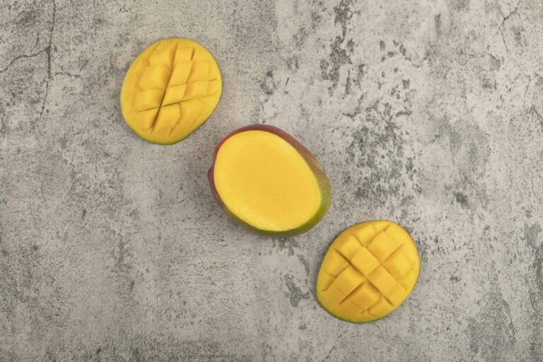 Diced mango on a marble worktop