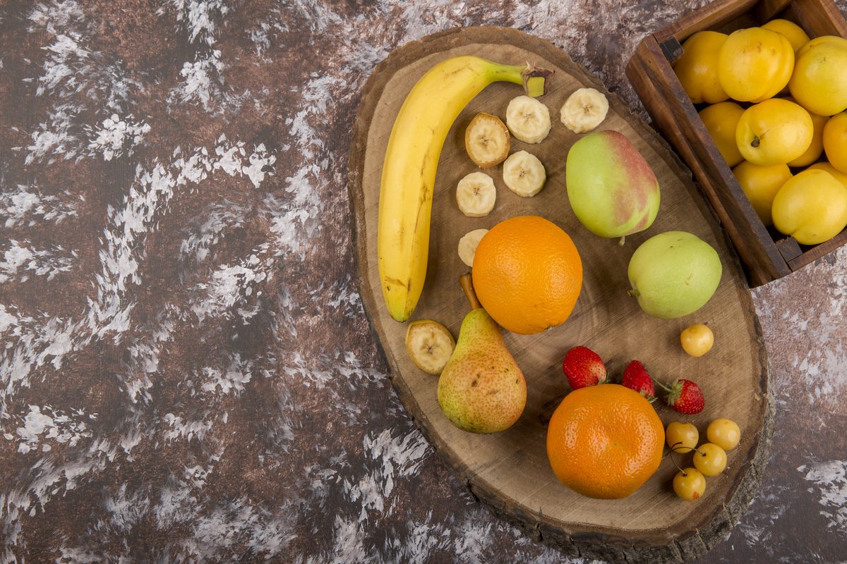 Assortment of fruit: banana, oranges, pears and apples