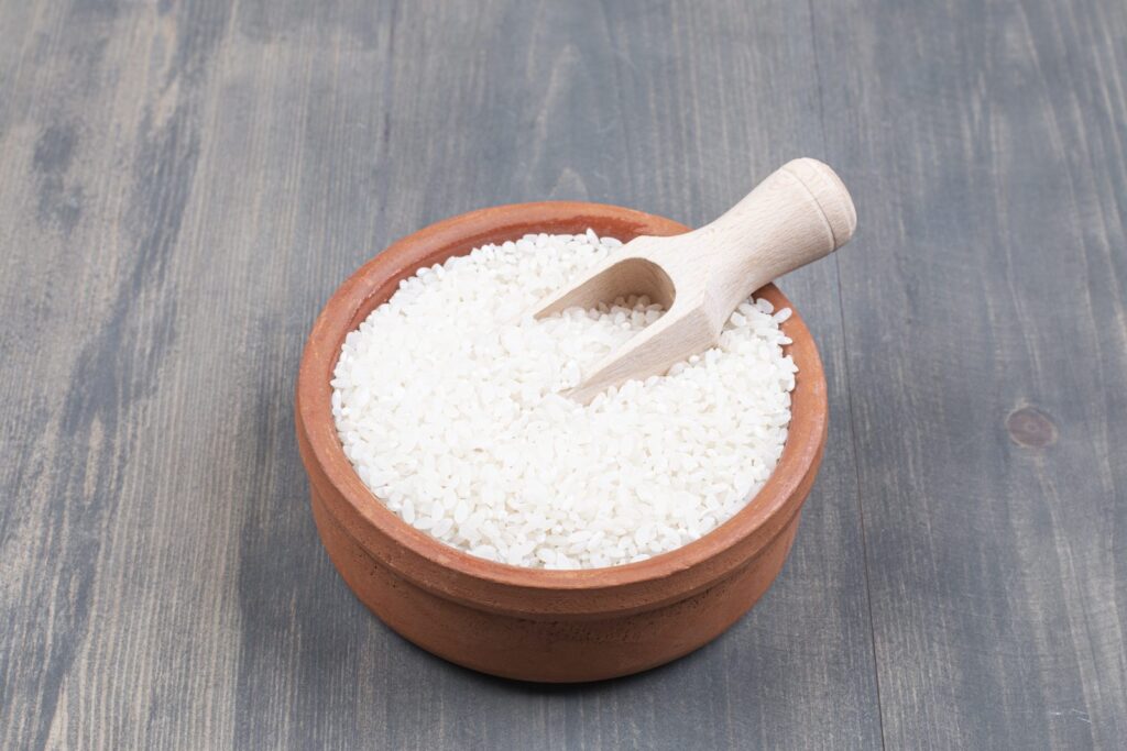 Portion of cooked rice in a bowl with a spoon