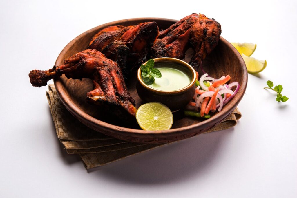 Tandoori chicken served with salad and chutney