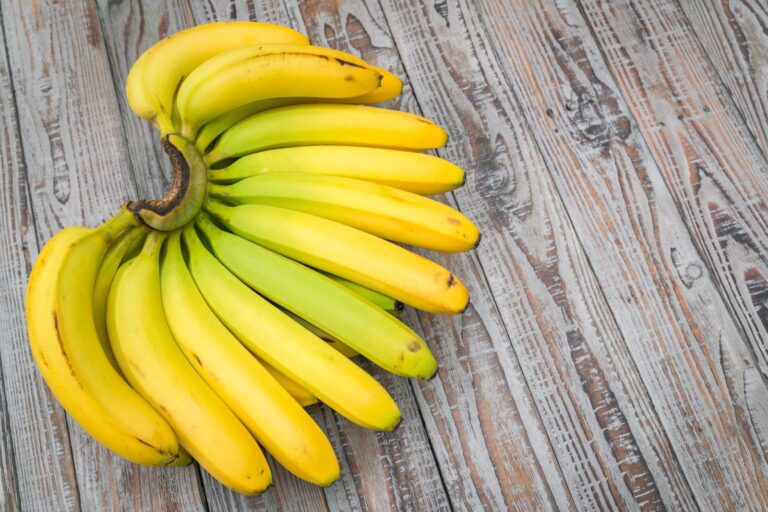 Bunch of fresh bananas on a wooden table