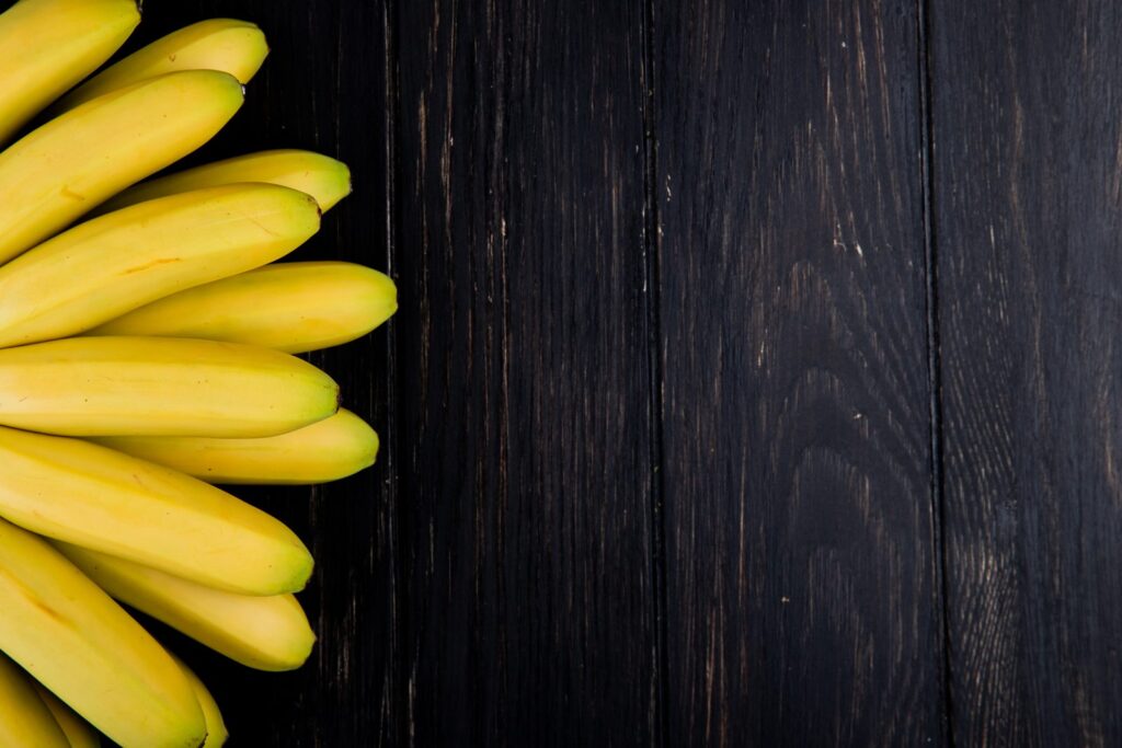 Bunch of ripe bananas on a wooden table