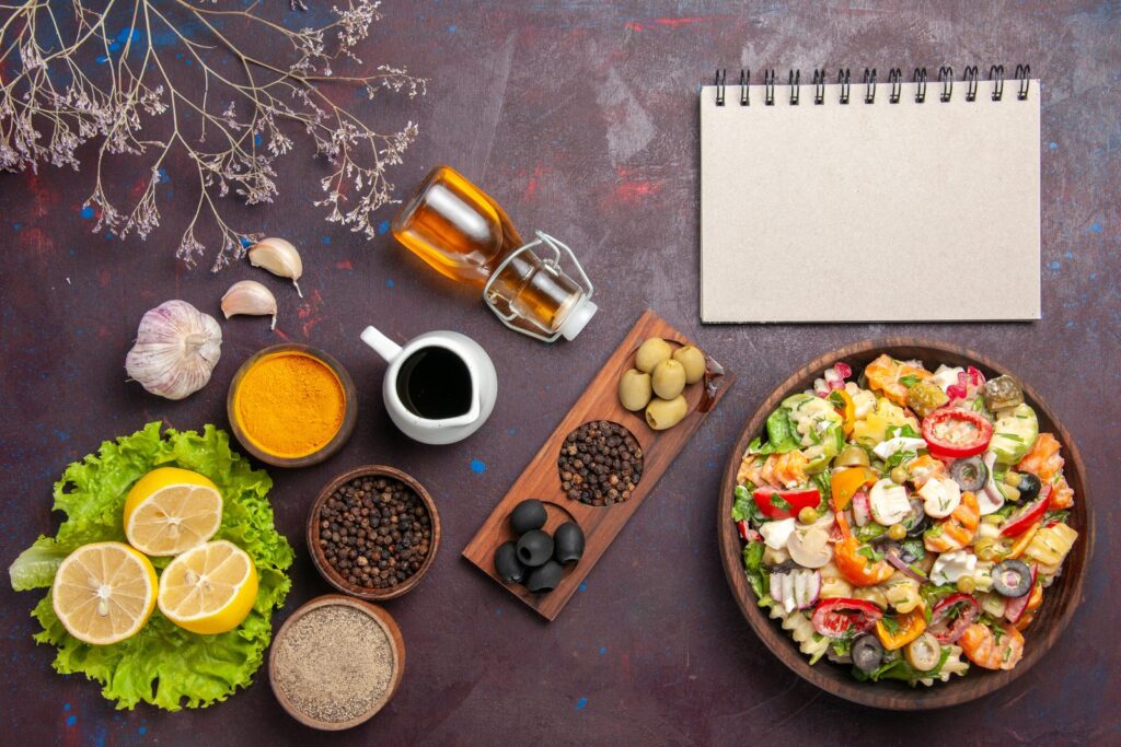 Vegetable salad with tomatoes, olives and mushrooms seen from above