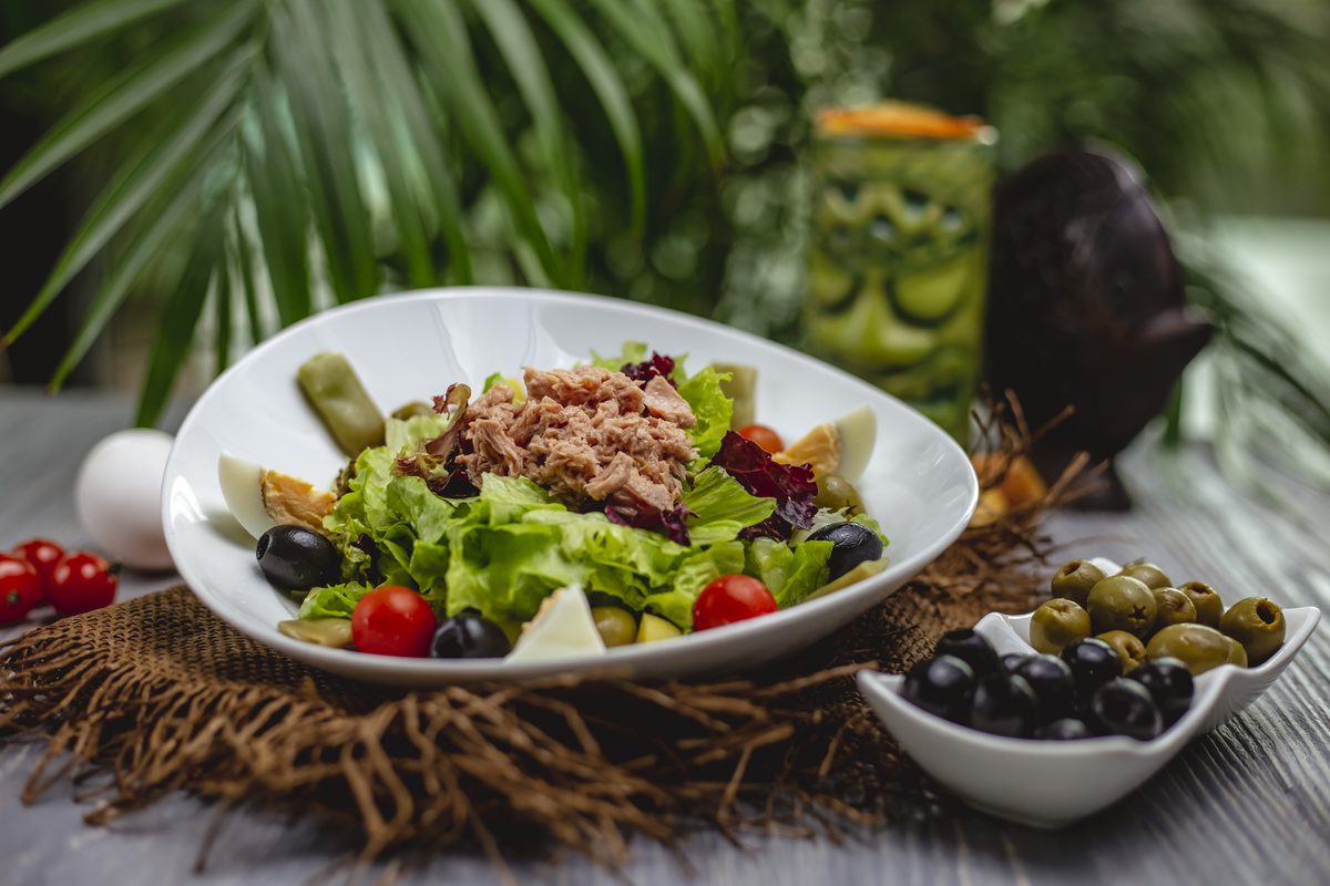 Tuna salad with cherry tomatoes, olives and hard-boiled egg