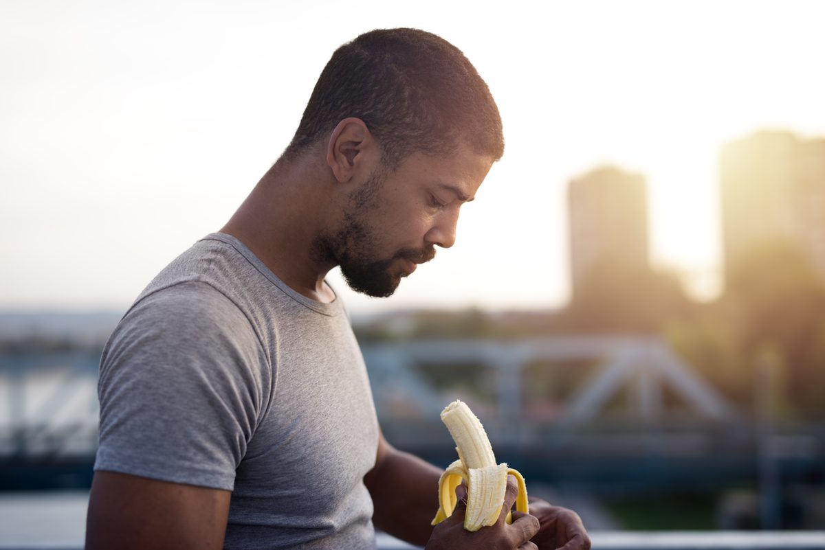 Athlete eating a banana after a training session