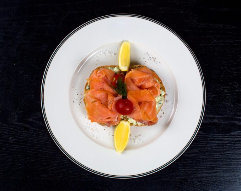 Slices of smoked salmon with lemon wedges