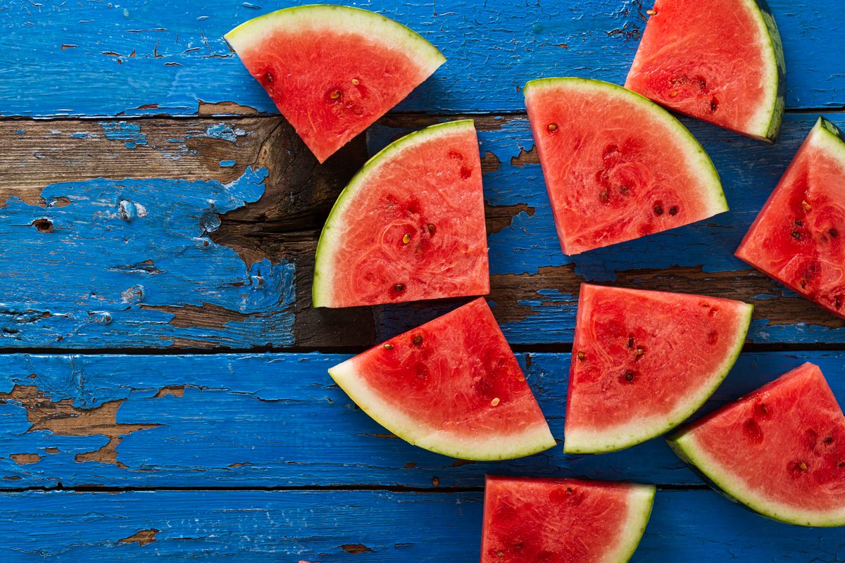 Watermelon triangles on a blue wooden table