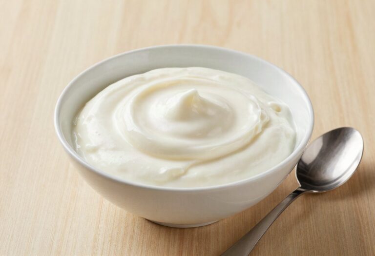 Bowl of stirred plain yoghurt