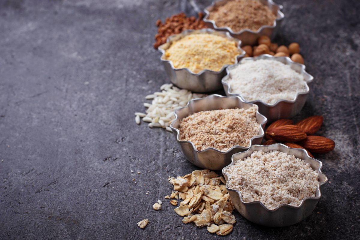 Small bowls of almond, buckwheat, rice, chickpea and oat flours