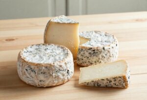 Aged Crottins de Chavignol, one cut in half