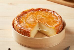 Époisses with an orange rind in its wooden box