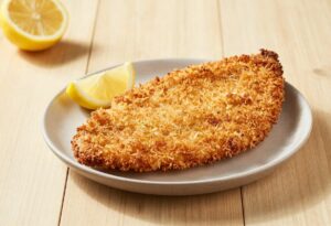 Breaded veal escalope and lemon