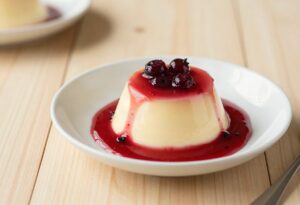 Panna cotta and red berry coulis