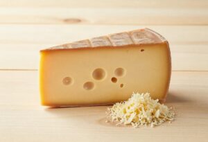 Piece of Gruyère and grated Gruyère