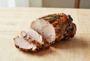 Sliced roast pork with herbs