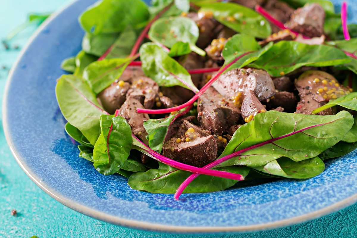 Chicken liver salad with baby spinach and chard shoots